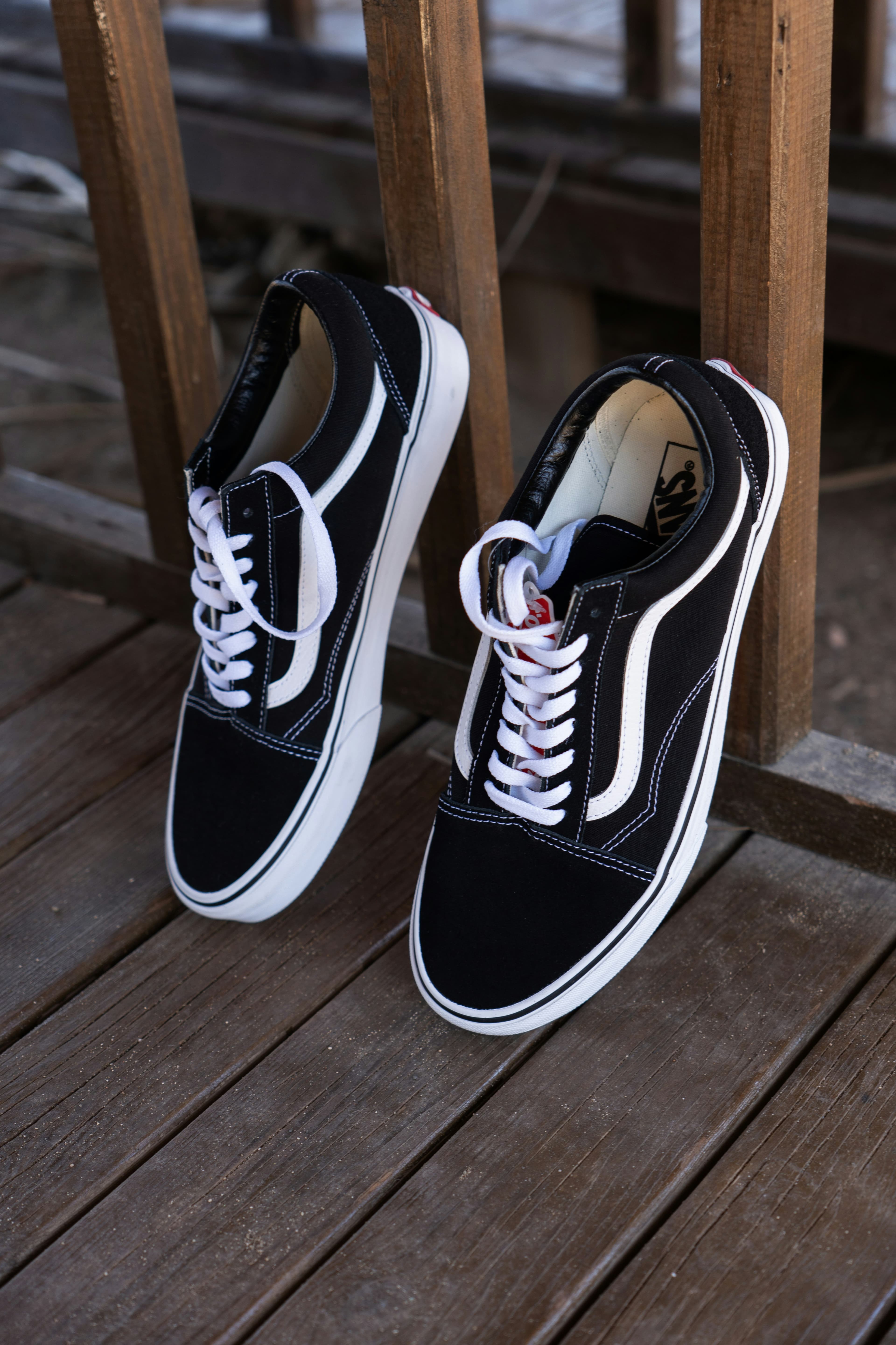 A pair of black Vans